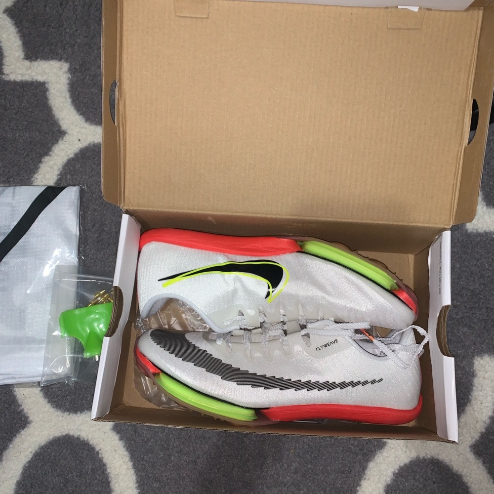 Brand new Nike Maxfly, authentic Nike sprinting spikes.